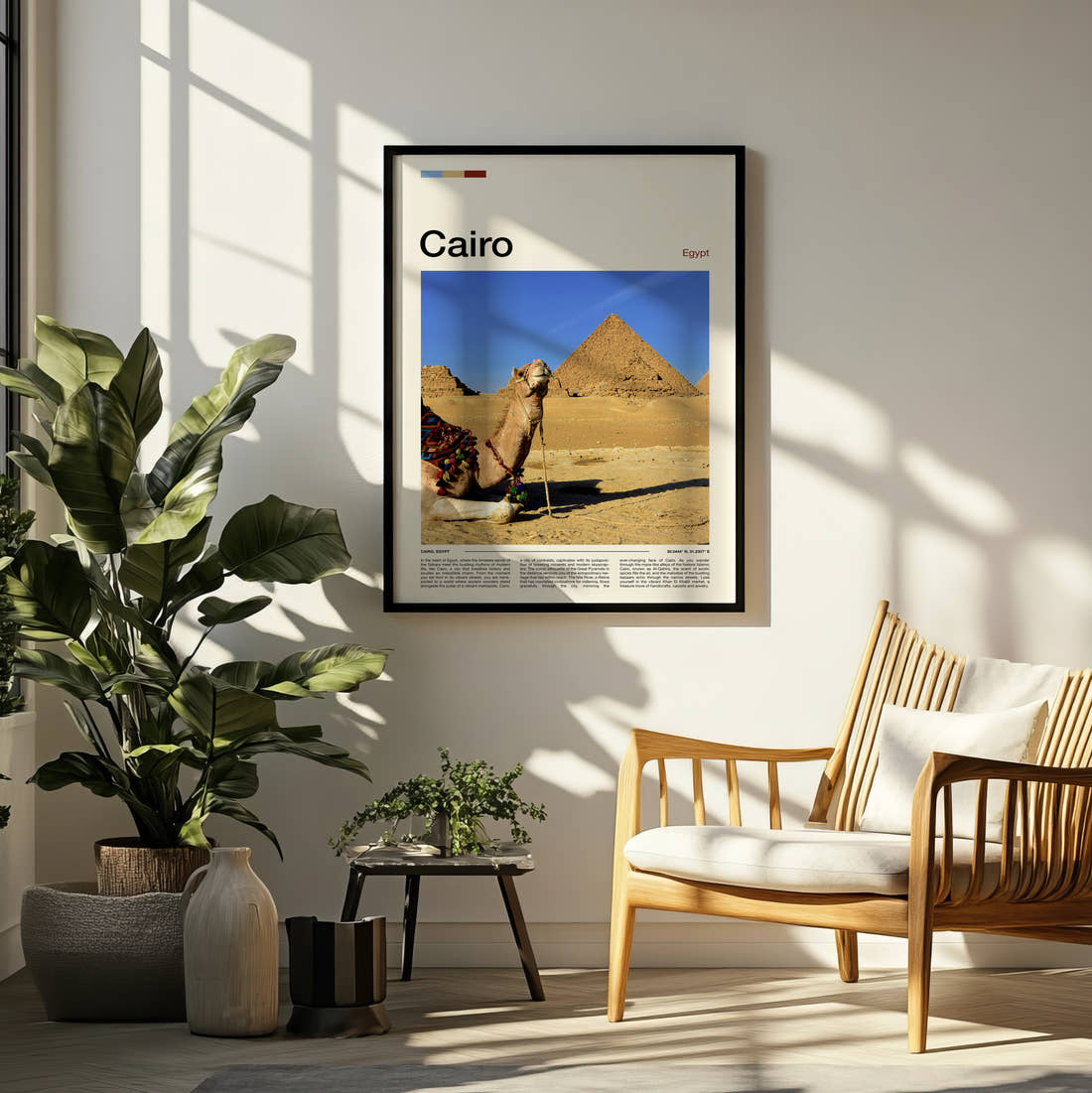 Cairo Camels And Pyramids Travel Print framed on a pale wall beside houseplants