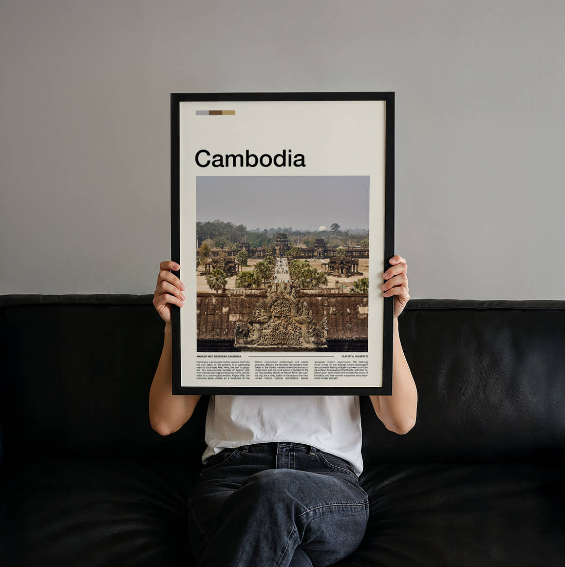 Cambodia Angkor Wat Causeway From Above Travel Print held up by hand to show the size of the print