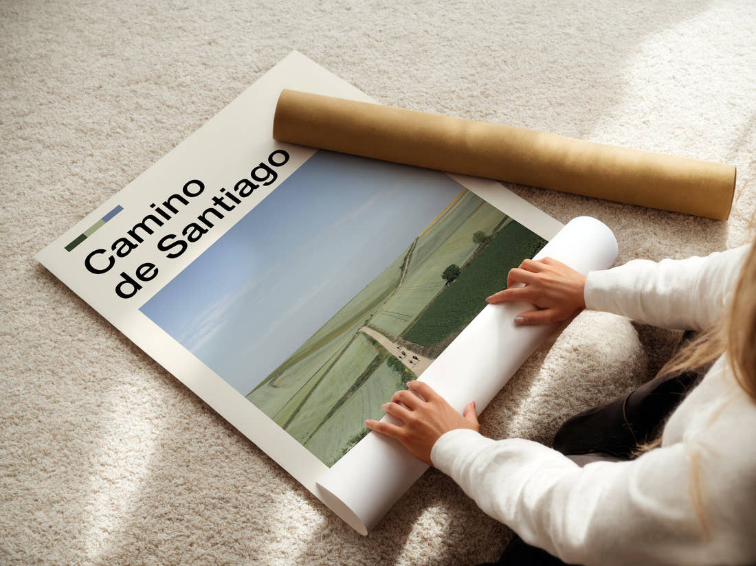 Camino De Santiago Path Through Fields Travel Print being unrolled from its postal tube