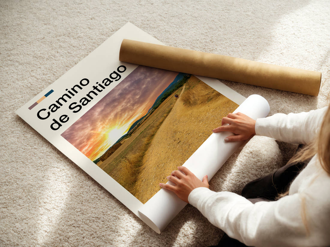 Camino De Santiago Sunset Over Fields Travel Print being unrolled from its postal tube