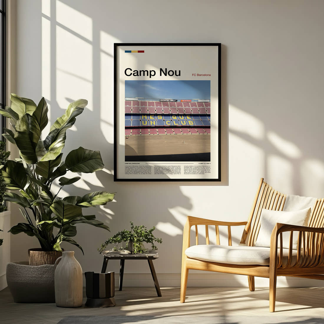 Camp Nou Stadium Print framed on a pale wall beside houseplants
