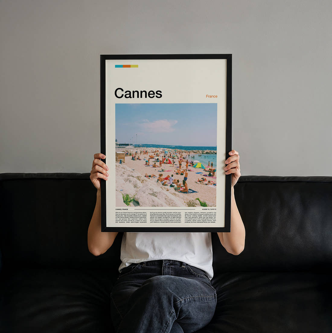 Cannes Crowded Beach Travel Print held up by hand to show the size of the print