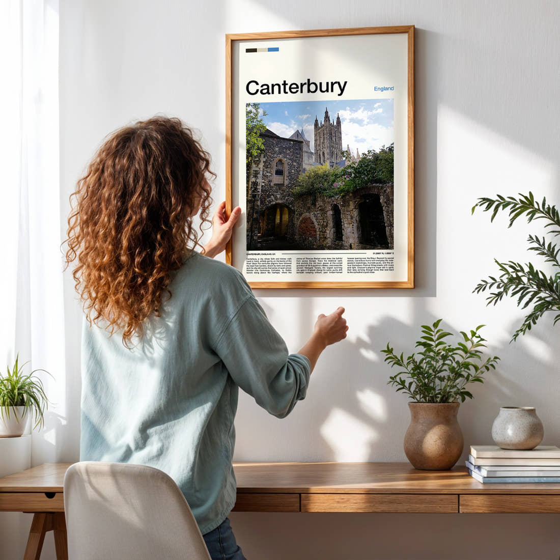 Canterbury Gothic Tower And Ruins Travel Print framed on a pale wall beside houseplants