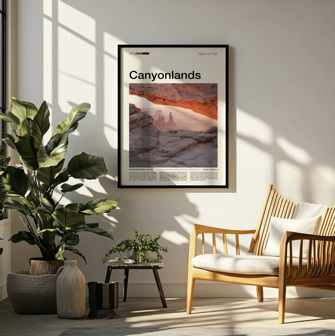 Canyonlands Mesa Arch At Sunrise Travel Print framed on a pale wall beside houseplants