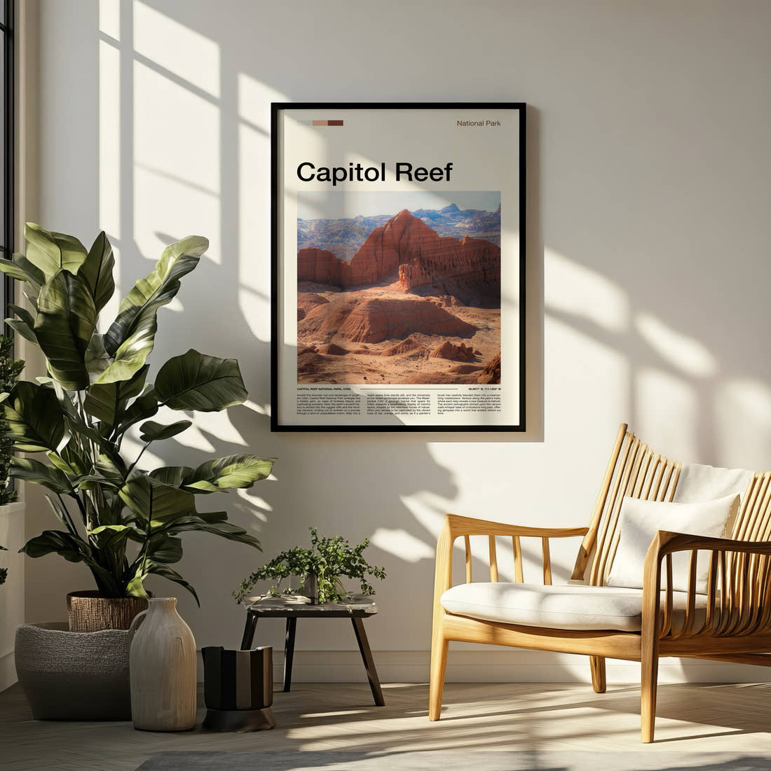 Capitol Reef Eroded Red Cliffs Travel Print framed on a pale wall beside houseplants