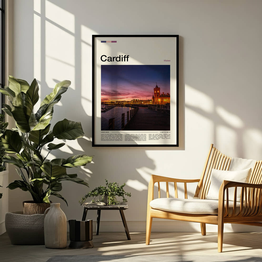 Cardiff Pierhead Building Travel Print framed on a pale wall beside houseplants