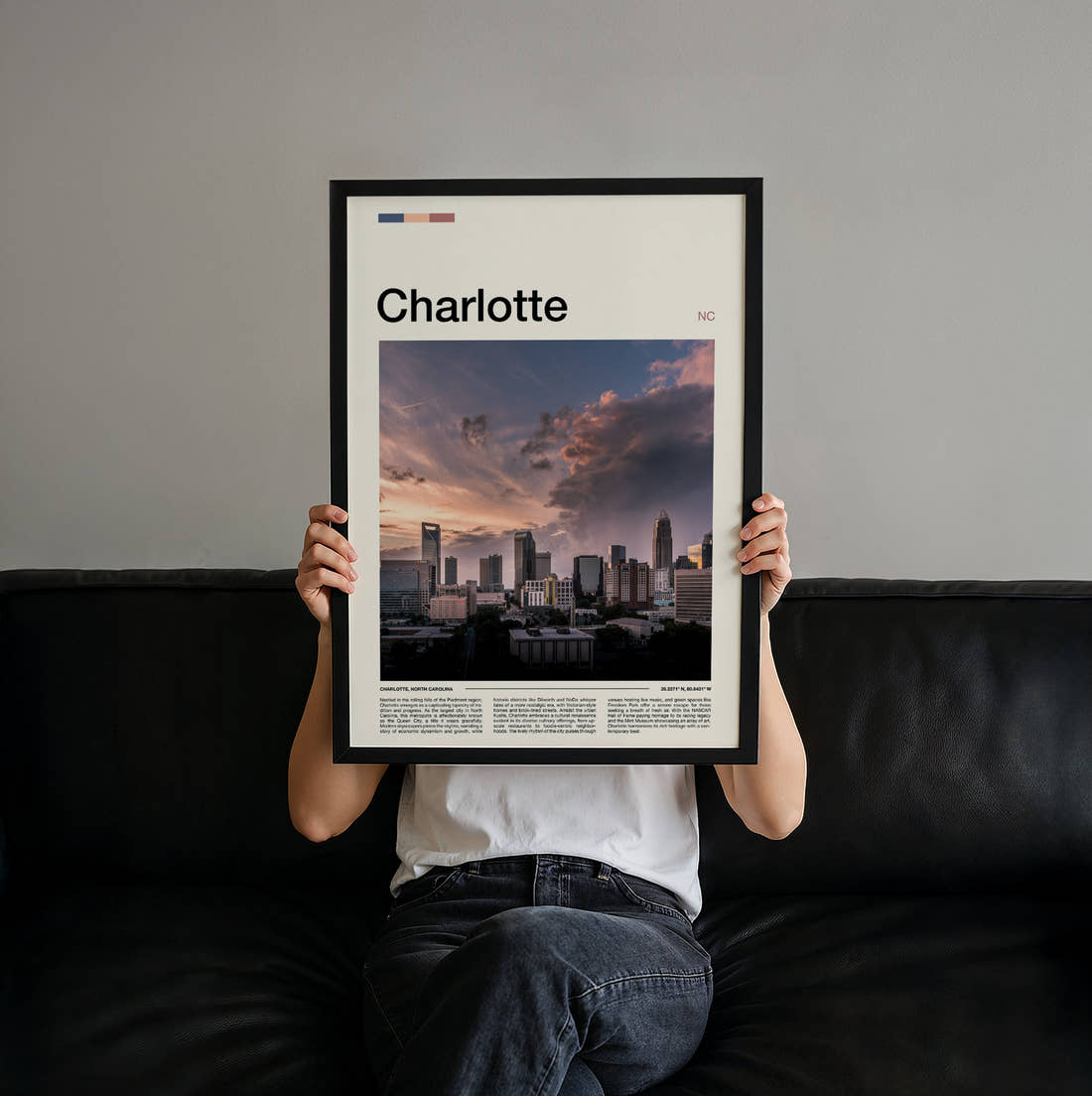 Charlotte Stormy Skyline Travel Print held up by hand to show the size of the print