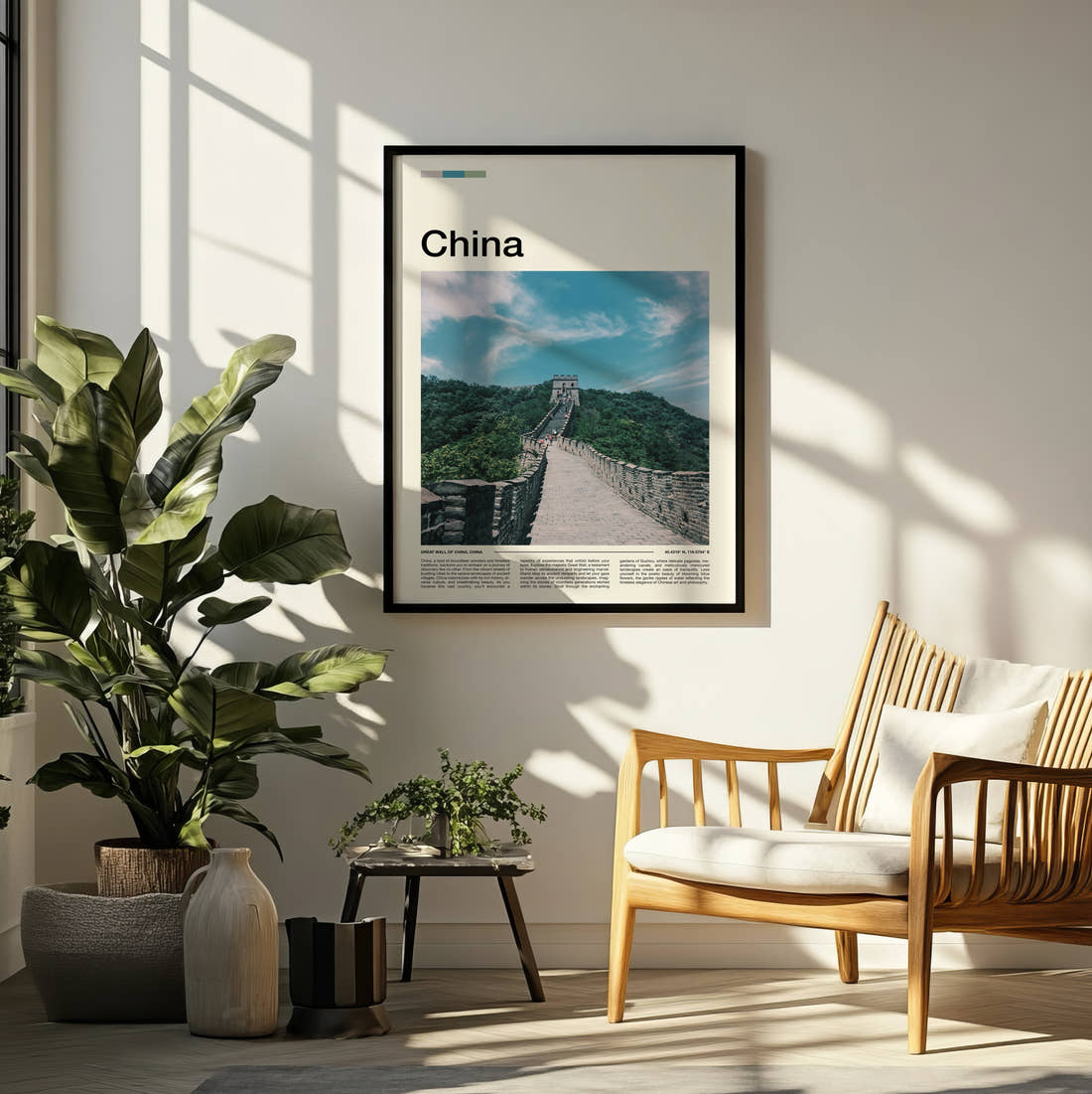 China Great Wall Through Green Hills Travel Print framed on a pale wall beside houseplants