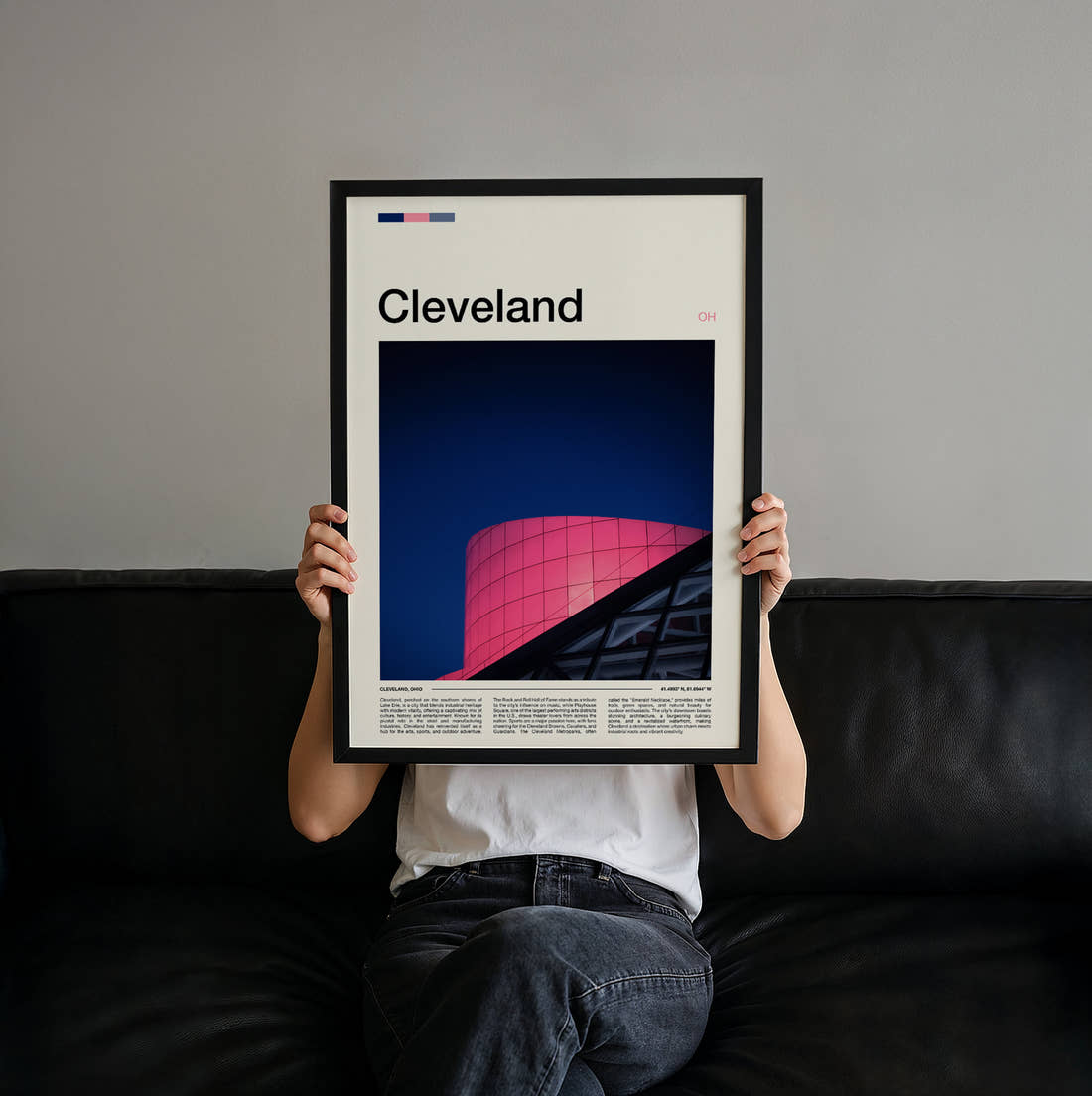 Cleveland Pink Glass Facade Travel Print held up by hand to show the size of the print