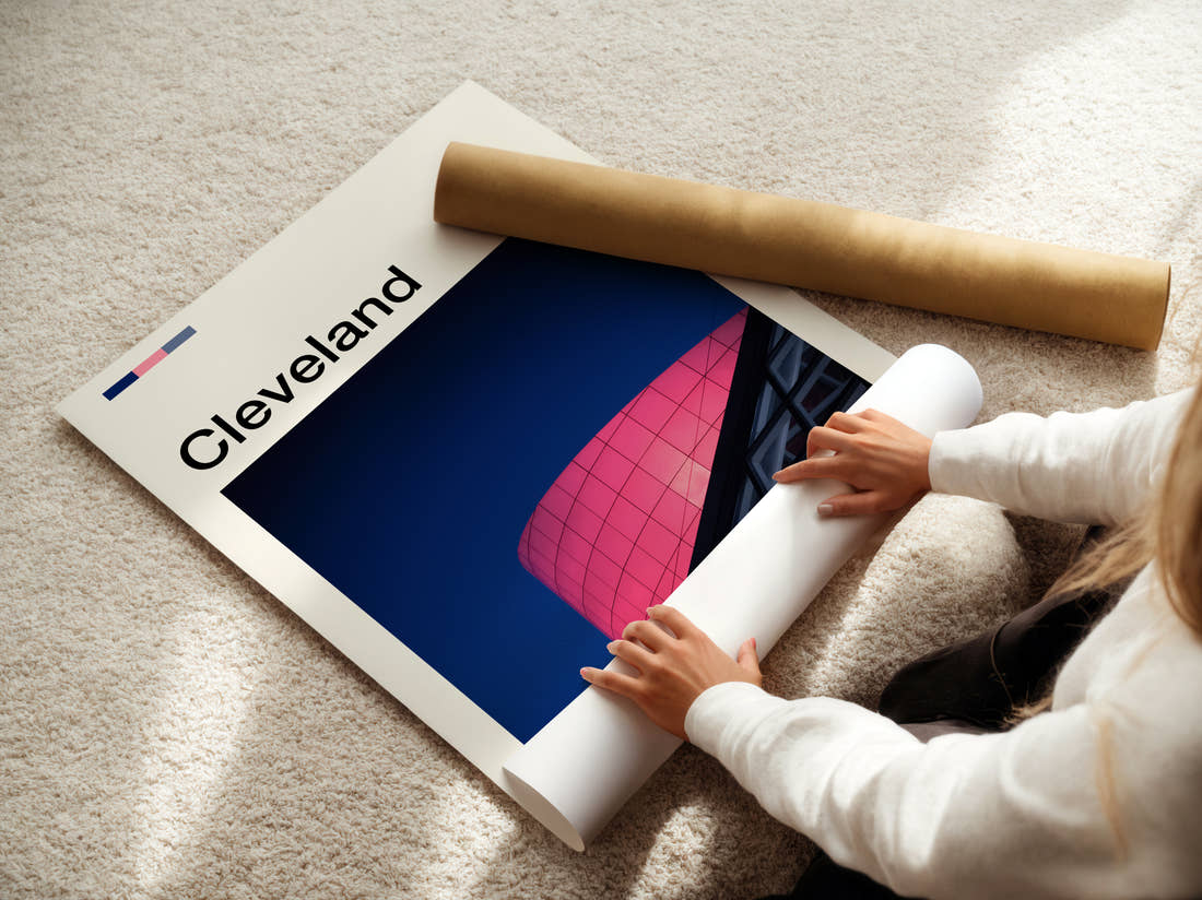 Cleveland Pink Glass Facade Travel Print being unrolled from its postal tube