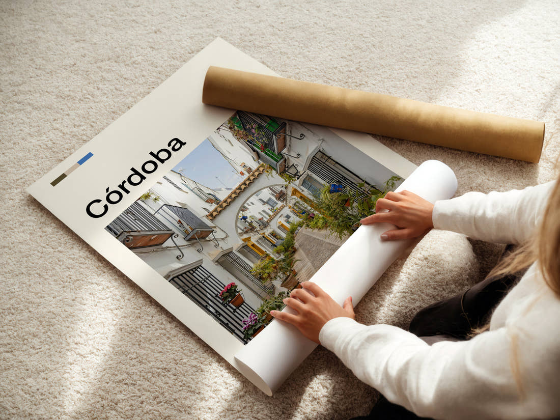 Córdoba Flower-Filled Alleyway Travel Print being unrolled from its postal tube