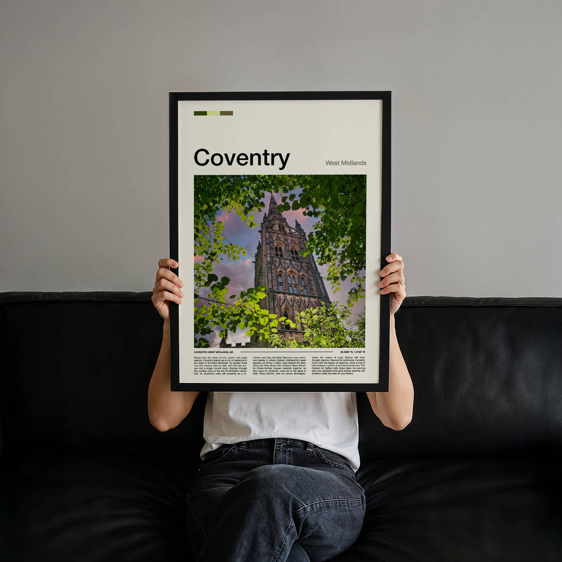 Coventry Cathedral Spire Through Leaves Travel Print held up by hand to show the size of the print
