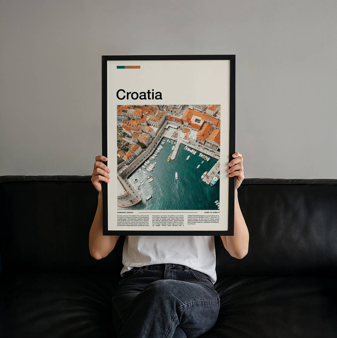 Croatia Harbour And Rooftops Travel Print held up by hand to show the size of the print