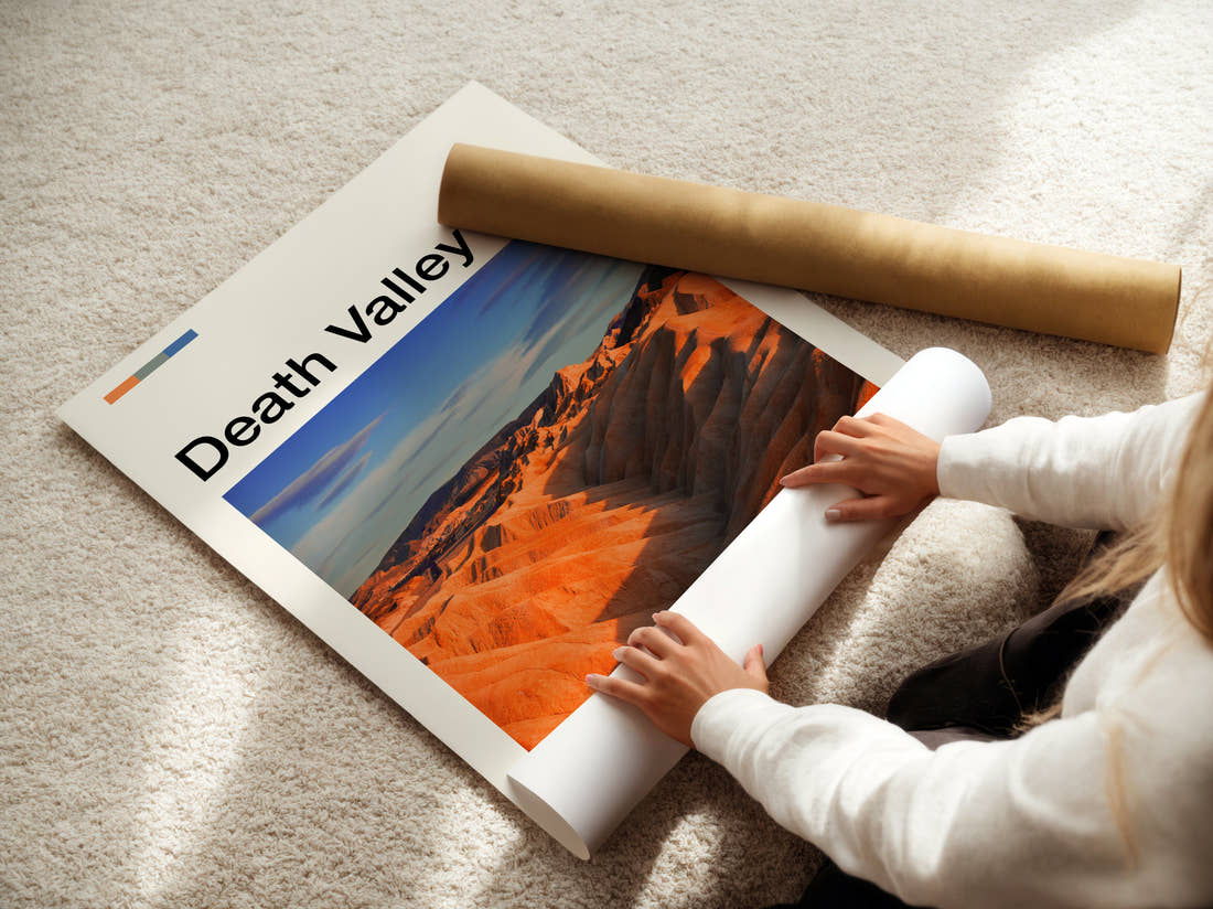 Death Valley Orange Desert Ridges Travel Print being unrolled from its postal tube