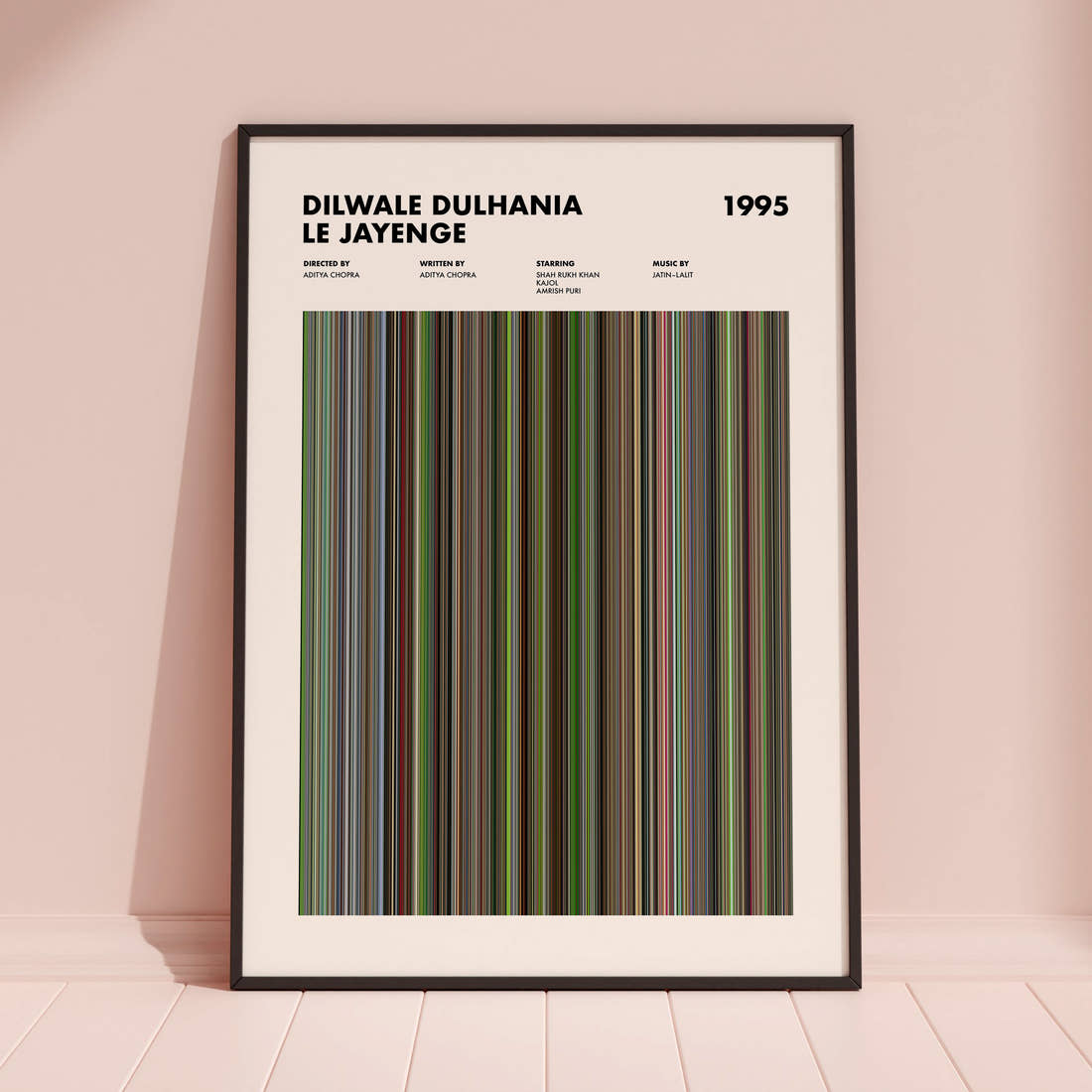 Dilwale Dulhania Le Jayenge Movie Barcode Poster framed and leaning against a coloured wall