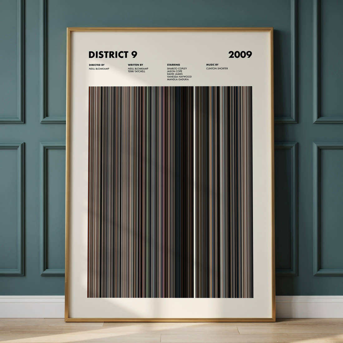 District 9 Movie Barcode Poster framed and leaning against a panelled wall