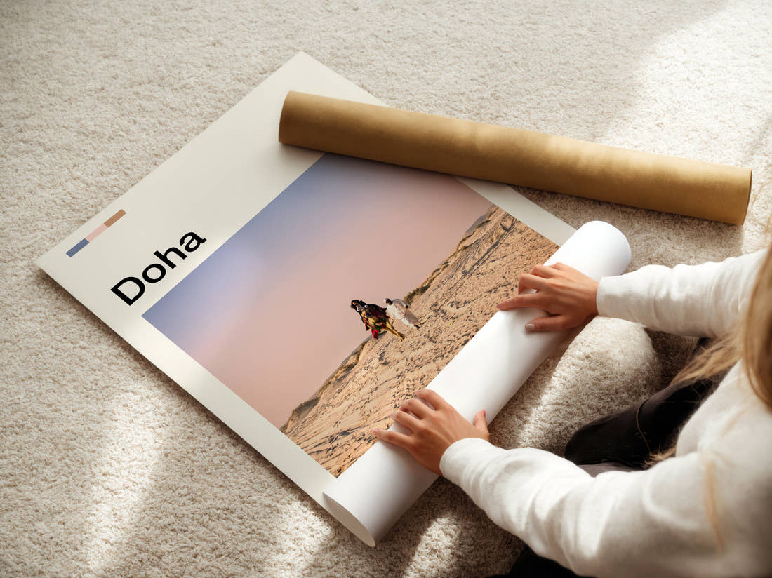 Doha Camel In The Desert Travel Print being unrolled from its postal tube