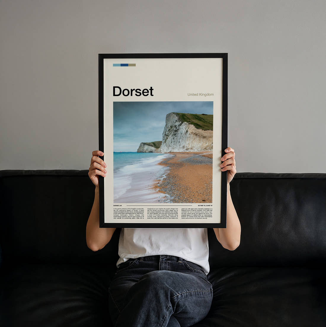 Dorset Chalk Cliffs And Beach Travel Print held up by hand to show the size of the print