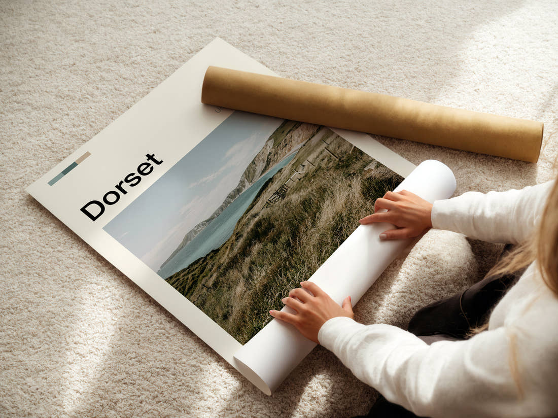 Dorset Clifftop Over The Bay Travel Print being unrolled from its postal tube