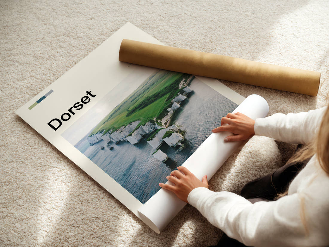 Dorset Old Harry Rocks Travel Print being unrolled from its postal tube