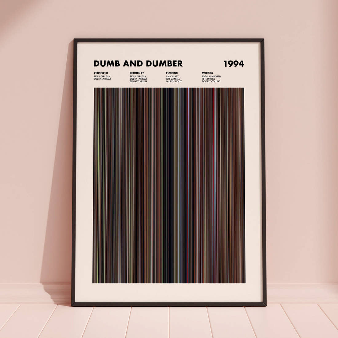 Dumb and Dumber Movie Barcode Poster framed and leaning against a coloured wall