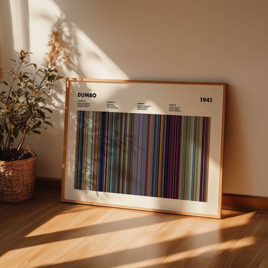 Dumbo Movie Barcode Poster framed and leaning against a wall on a wooden floor