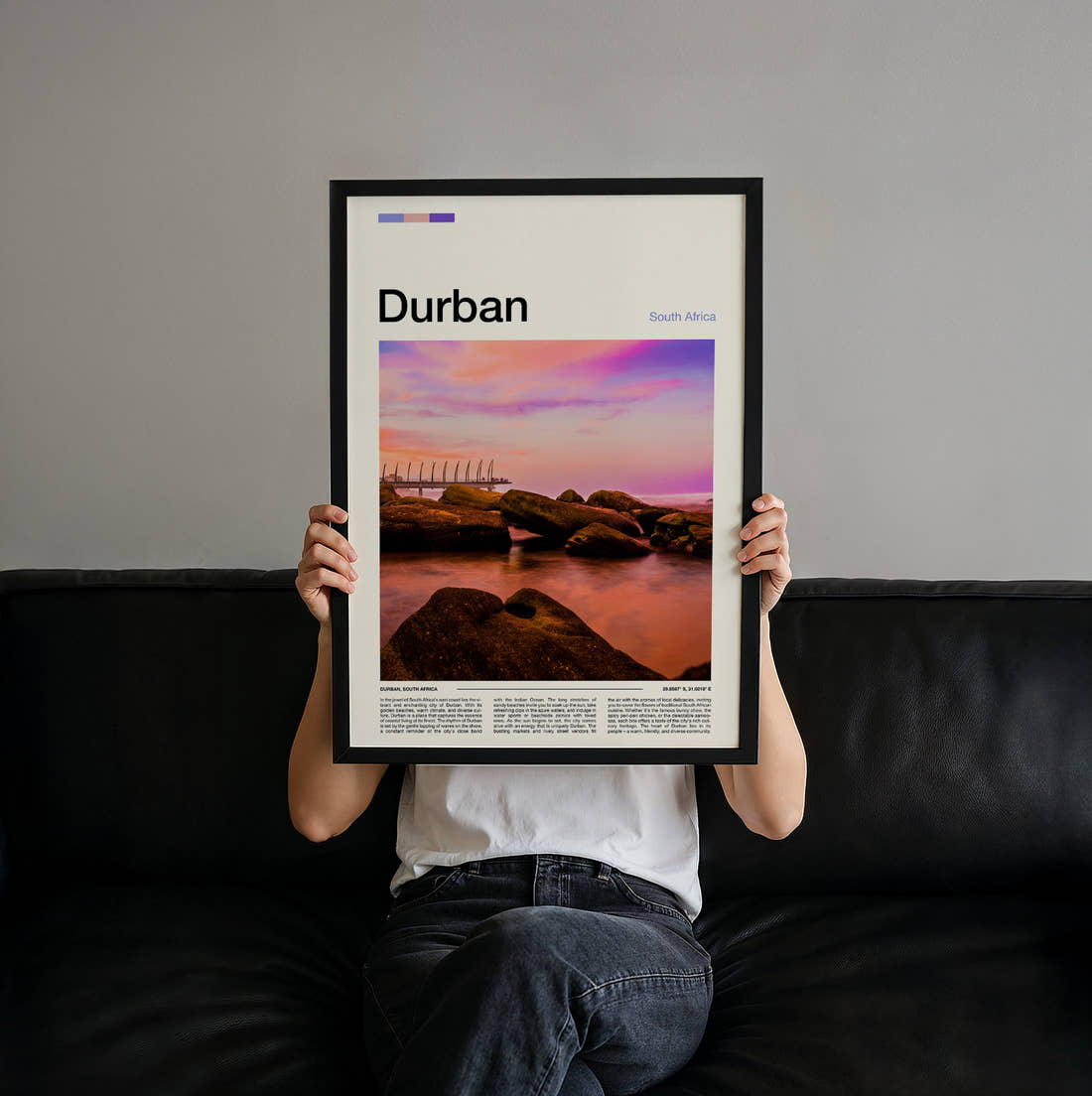 Durban Sunset Over The Rocks Travel Print held up by hand to show the size of the print