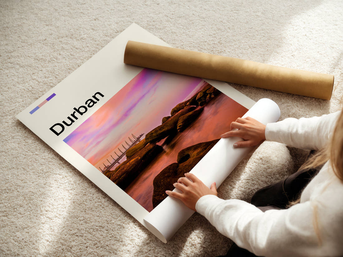 Durban Sunset Over The Rocks Travel Print being unrolled from its postal tube
