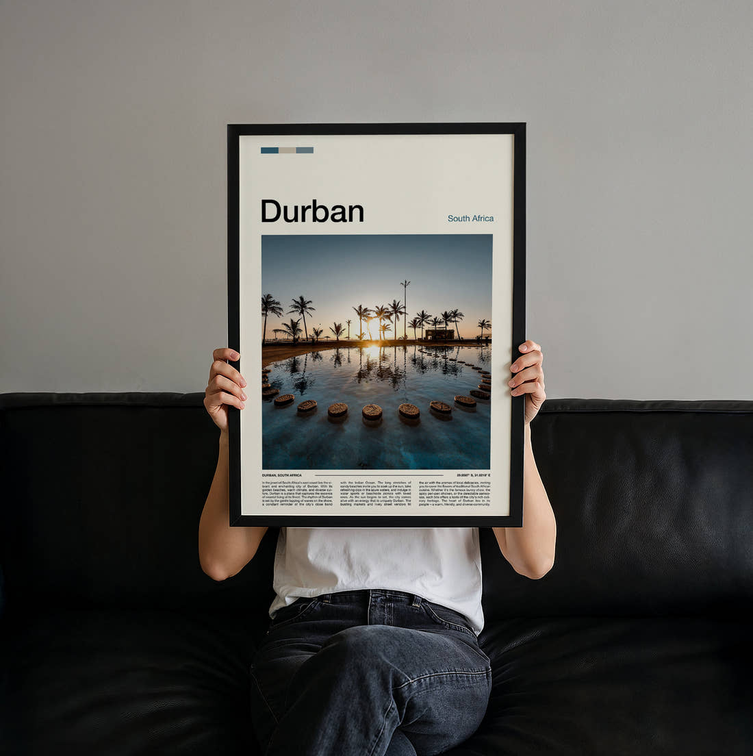 Durban Sunset Over The Water Travel Print held up by hand to show the size of the print