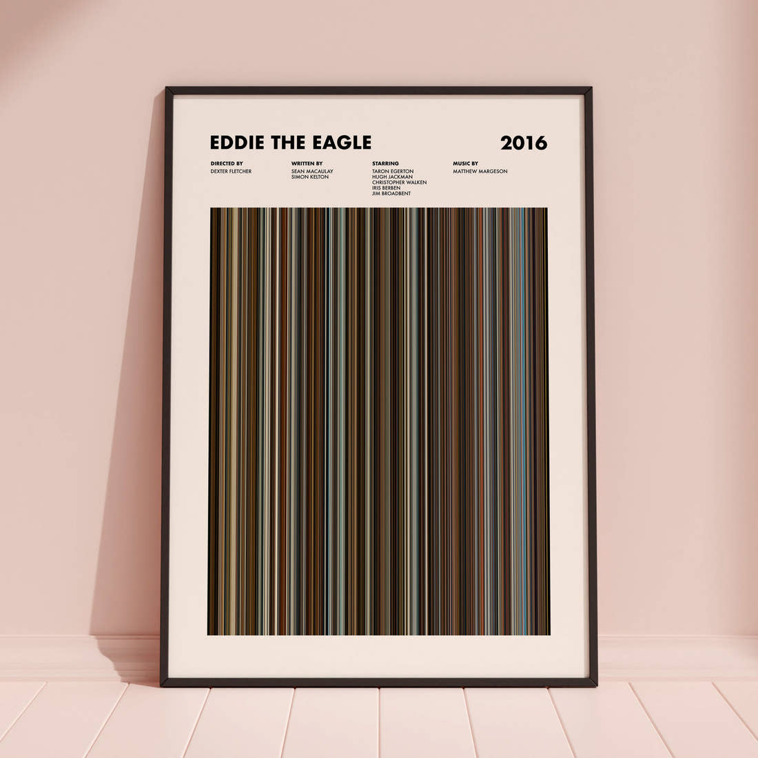 Eddie the Eagle Movie Barcode Poster framed and leaning against a coloured wall