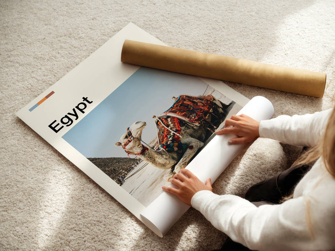 Egypt Camel And Pyramid Travel Print being unrolled from its postal tube