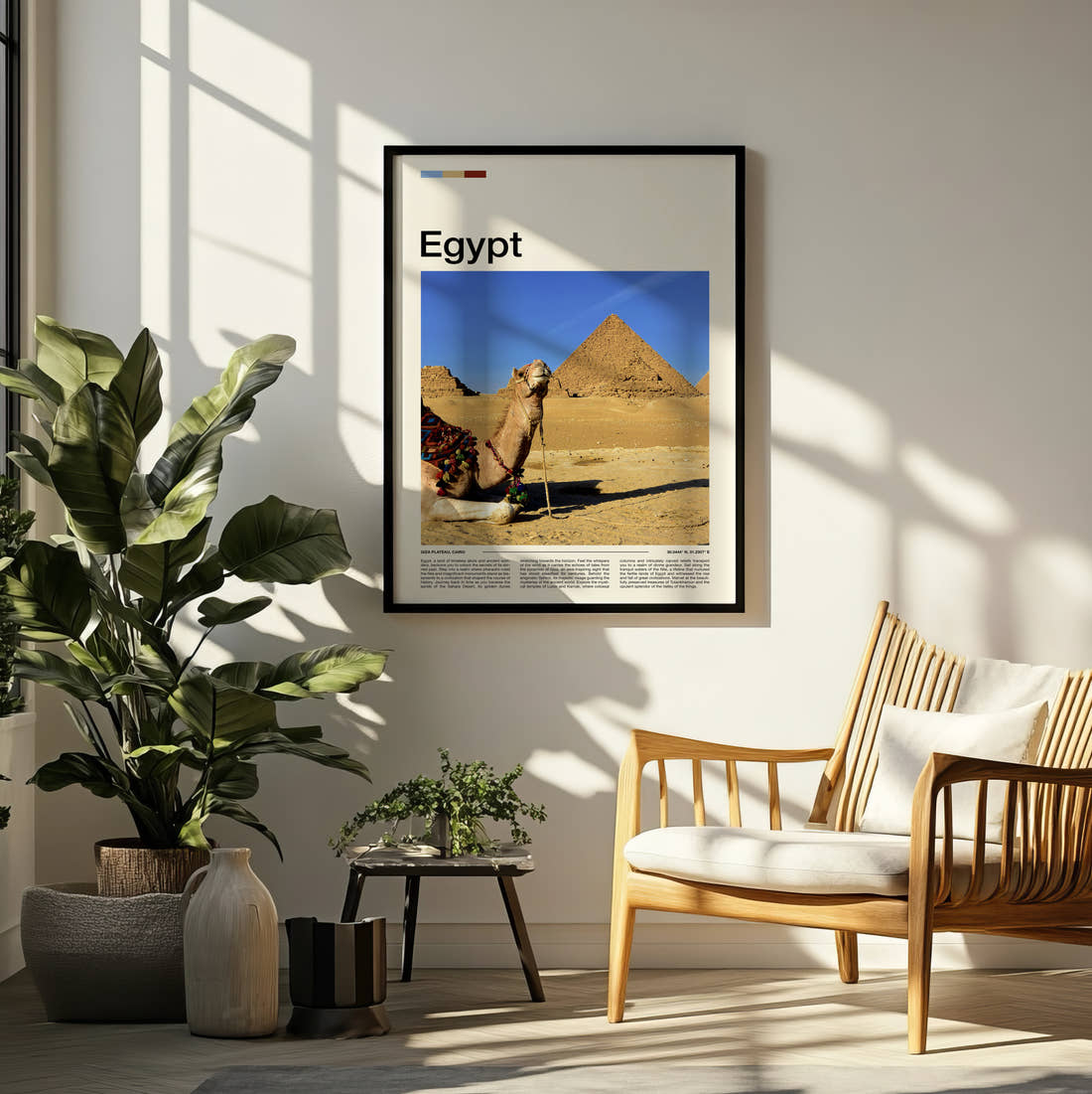 Egypt Camel And Pyramids Travel Print framed on a pale wall beside houseplants