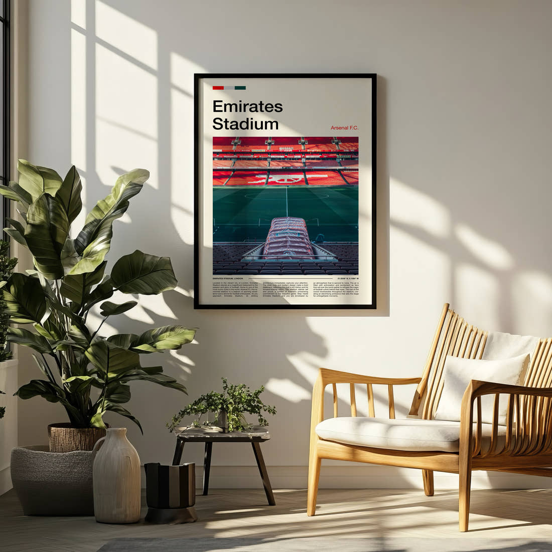 Emirates Stadium Print framed on a pale wall beside houseplants