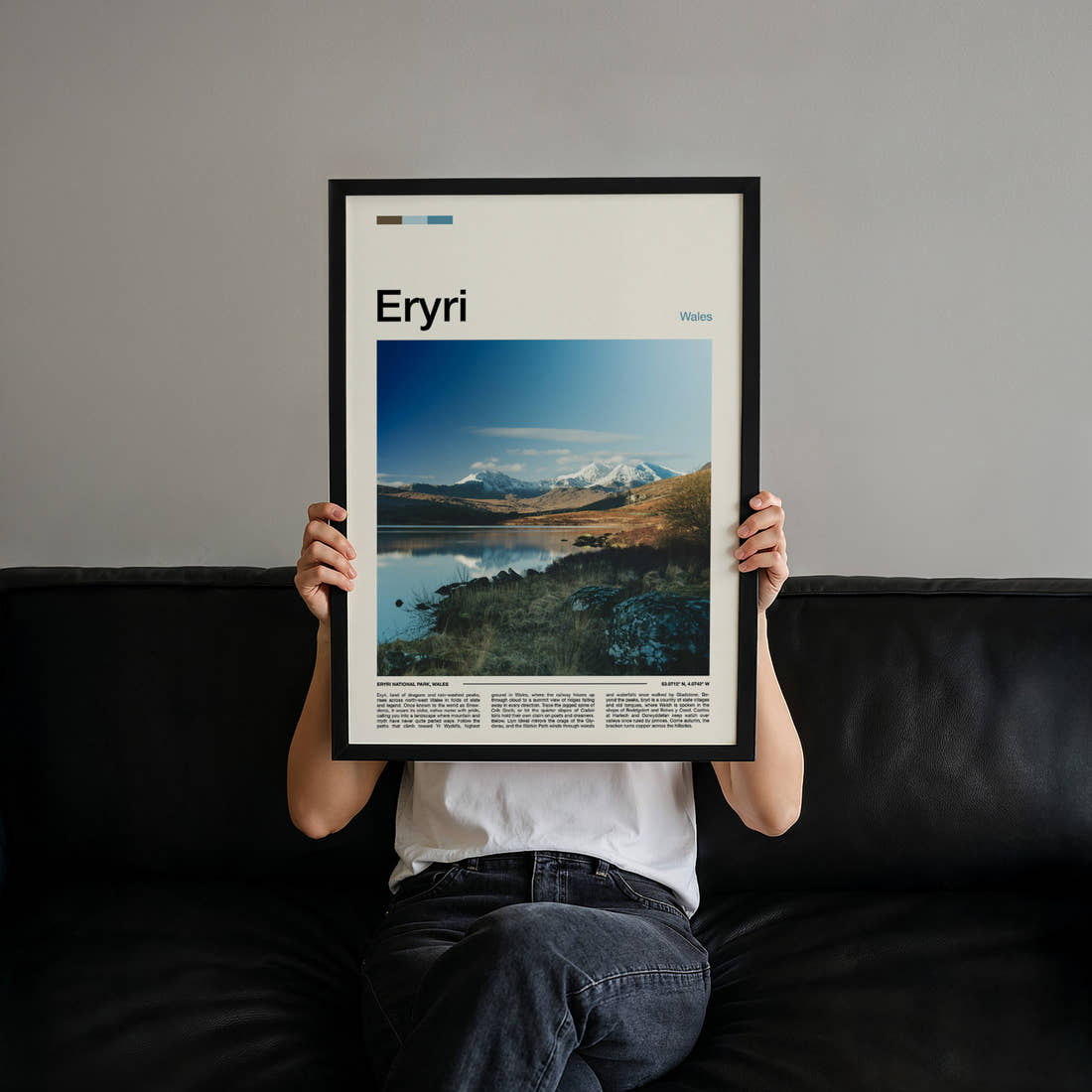 Eryri Snow-Capped Mountain Range Travel Print held up by hand to show the size of the print