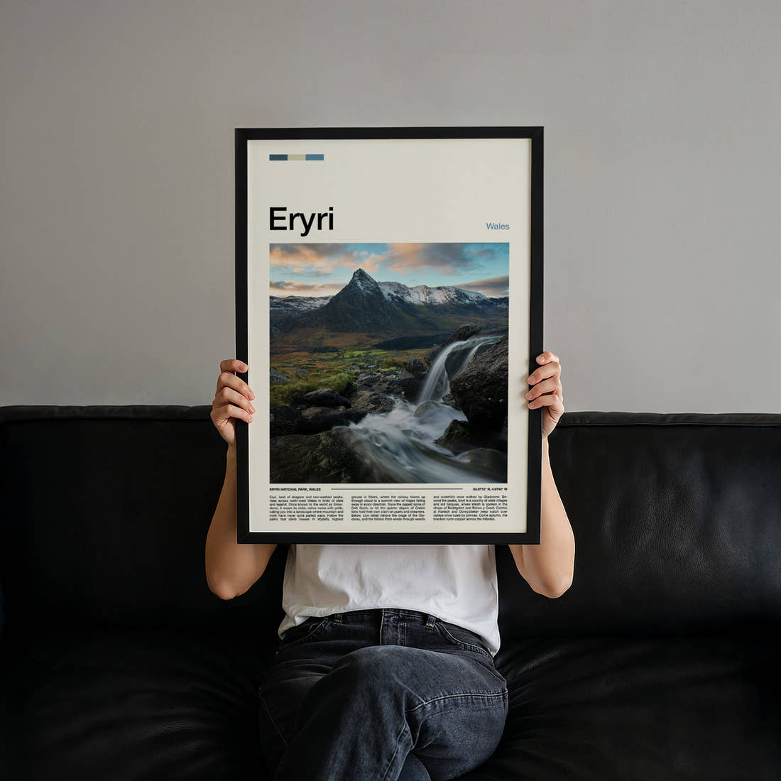 Eryri Waterfall And Peak Travel Print held up by hand to show the size of the print