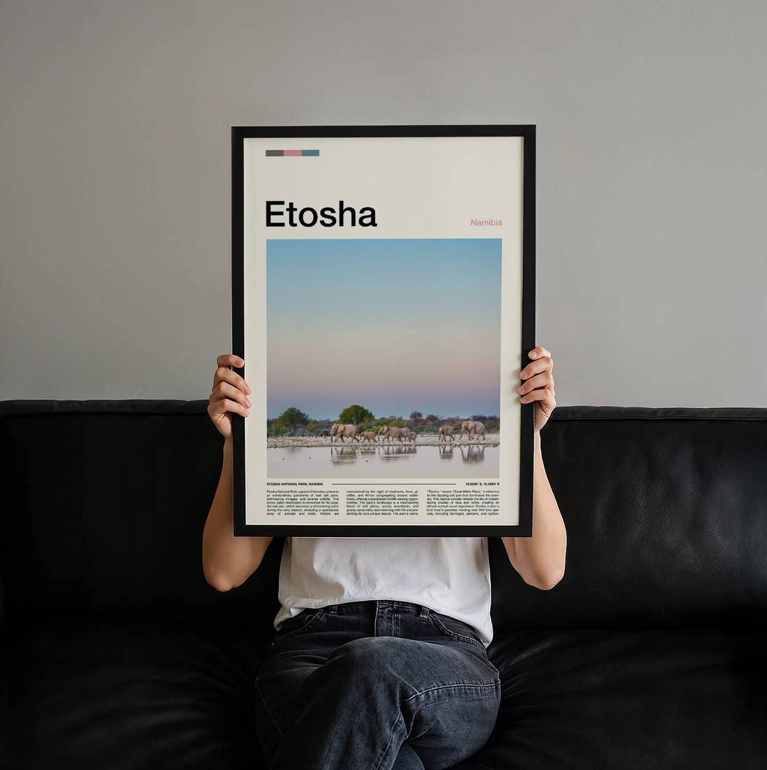 Etosha Elephants At The Waterhole Travel Print held up by hand to show the size of the print