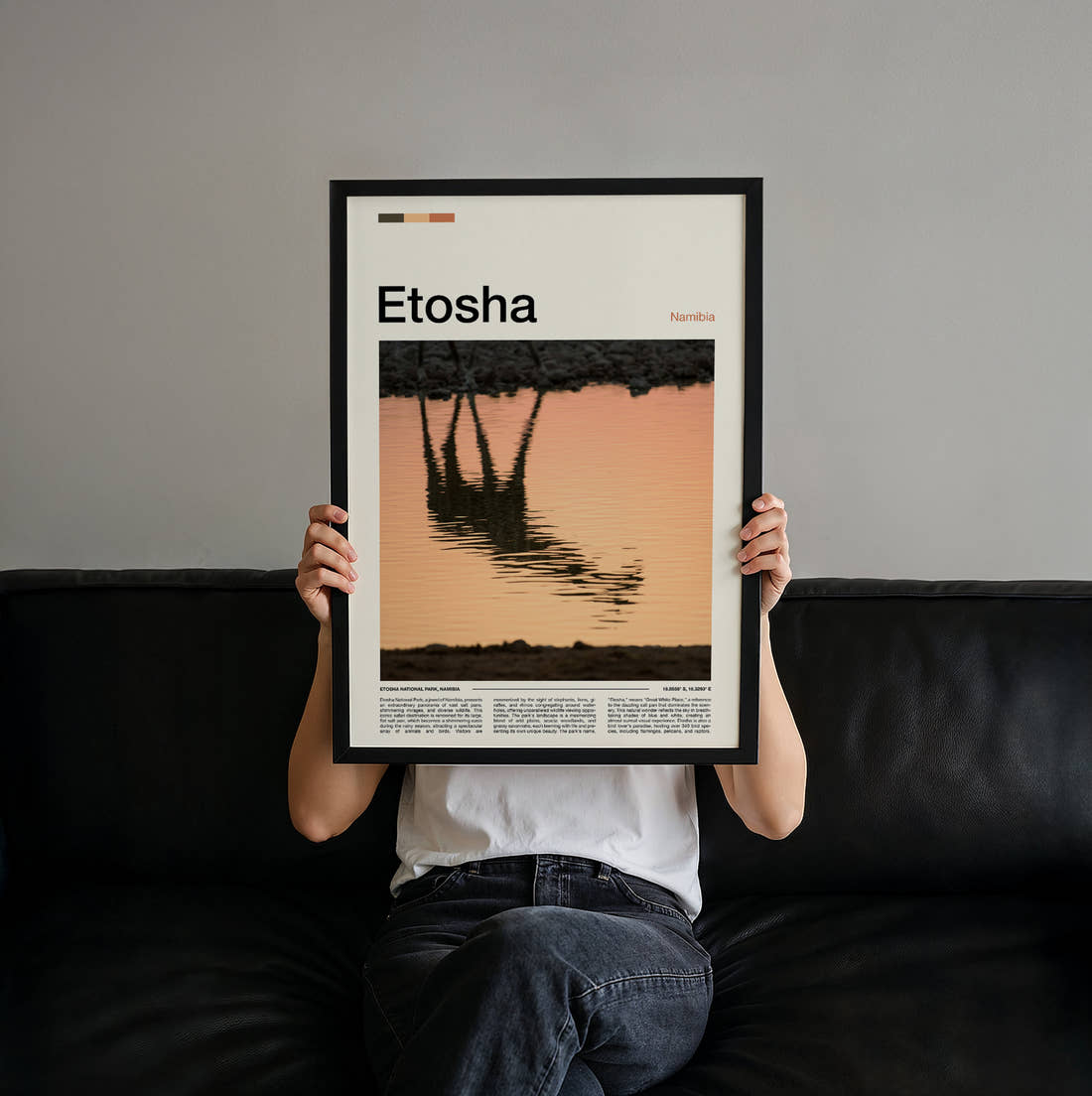 Etosha Giraffe Reflection Travel Print held up by hand to show the size of the print