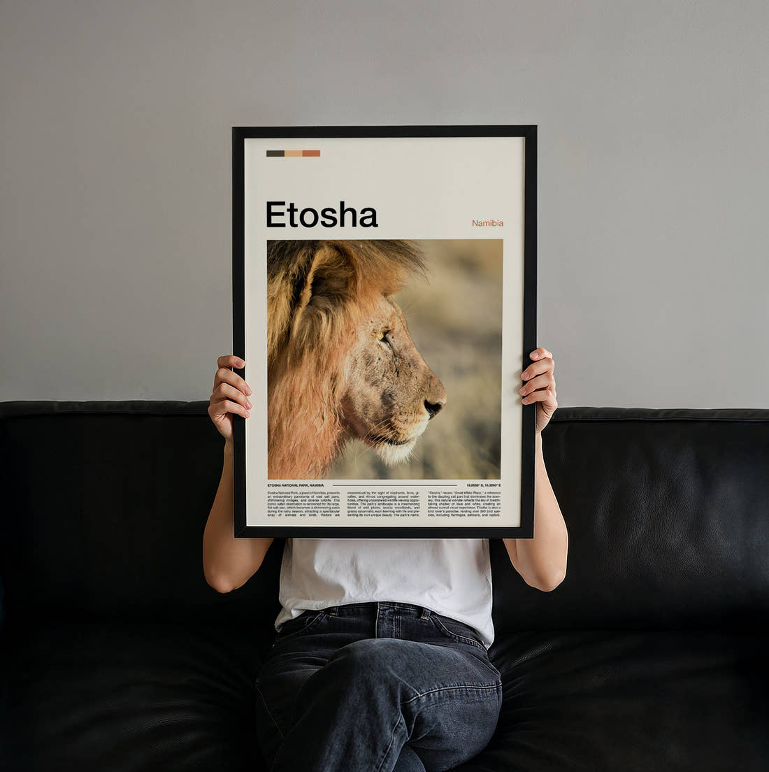 Etosha Lion Portrait Travel Print held up by hand to show the size of the print