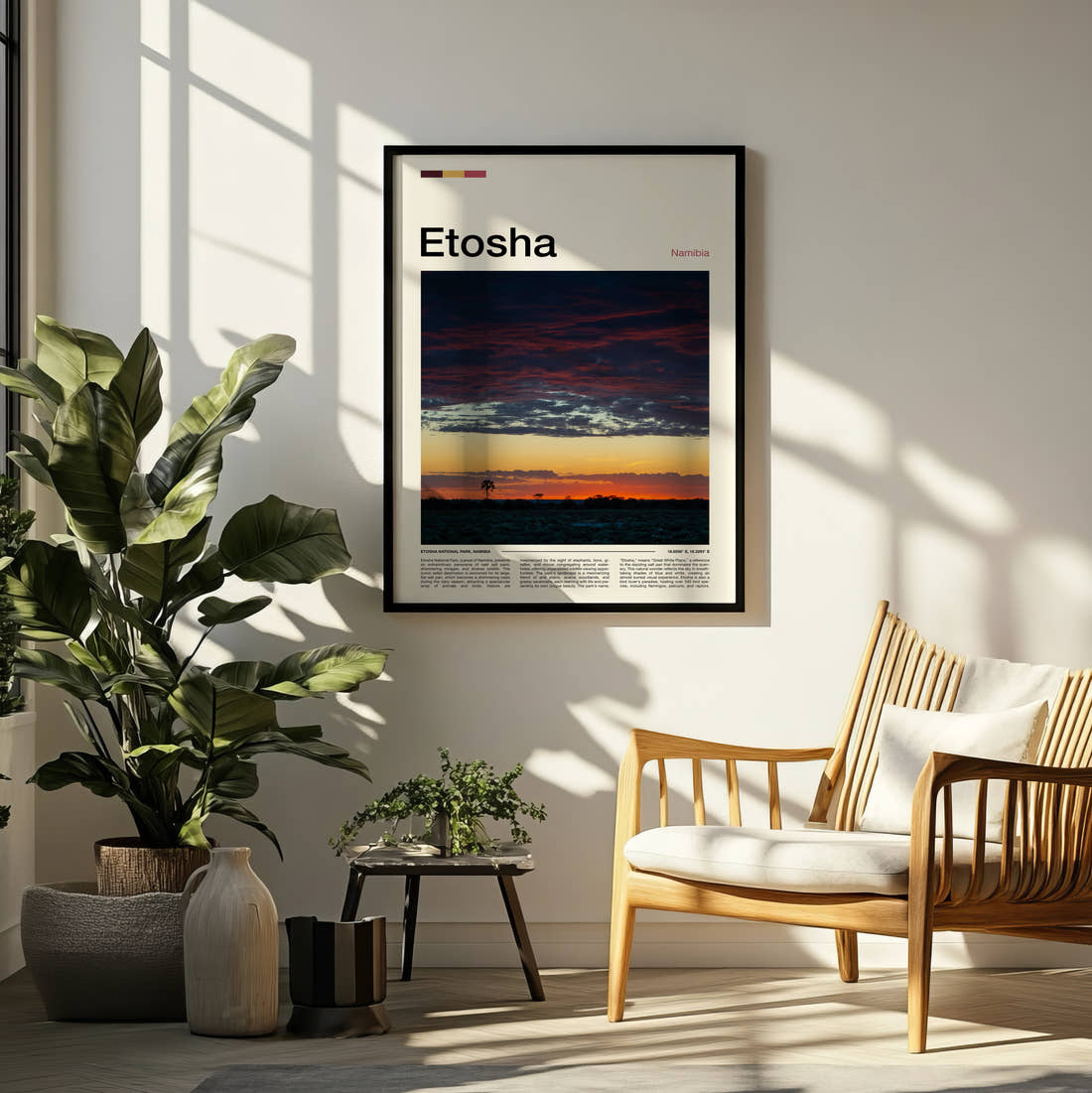 Etosha Dramatic Sunset Sky Travel Print framed on a pale wall beside houseplants