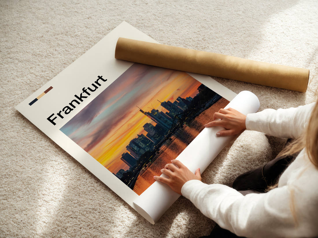 Frankfurt Skyline At Sunset Travel Print being unrolled from its postal tube