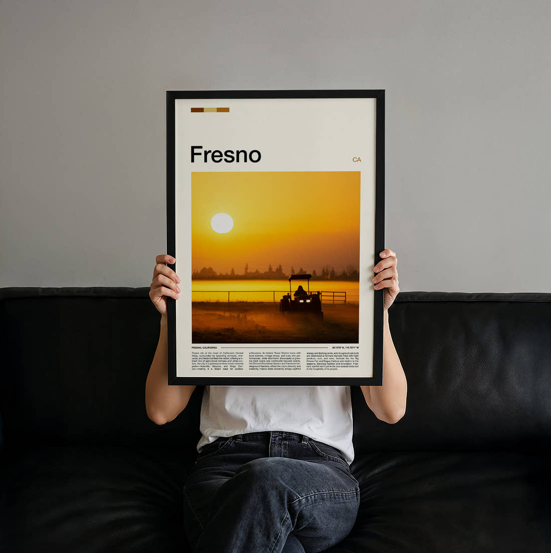 Fresno Tractor At Sunset Travel Print held up by hand to show the size of the print