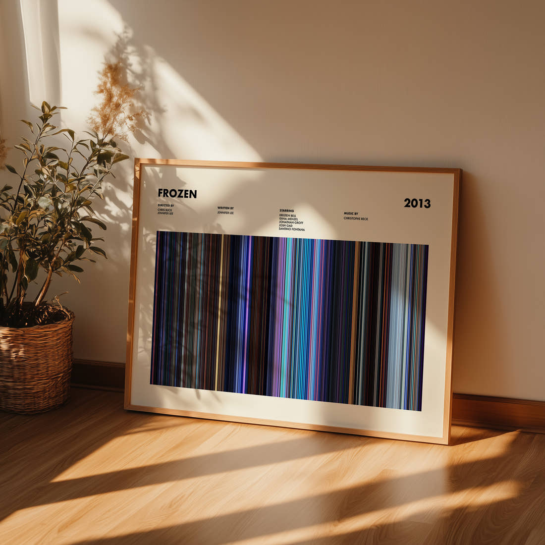 Frozen Movie Barcode Poster framed and leaning against a wall on a wooden floor