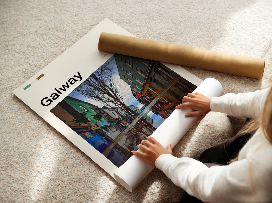Galway Reflections In A Puddle Travel Print being unrolled from its postal tube