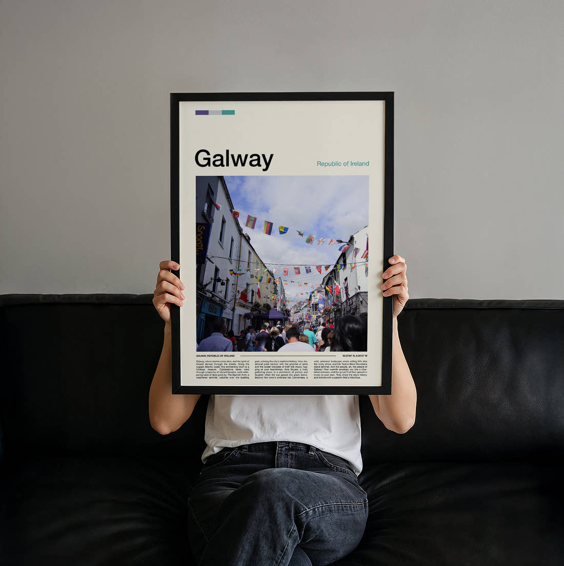 Galway Street With Bunting Travel Print held up by hand to show the size of the print