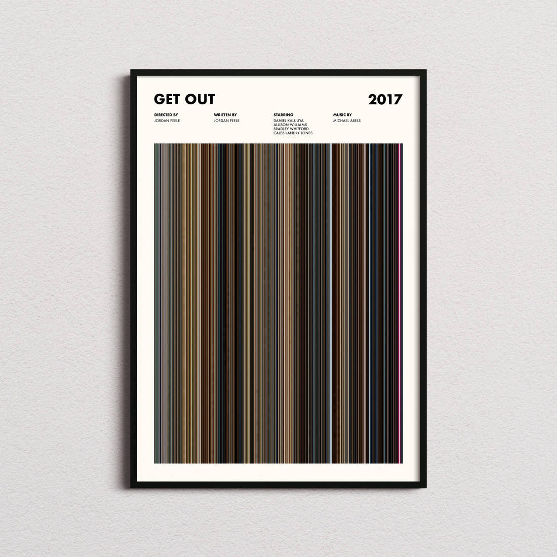 Get Out Movie Barcode Poster framed on a plain studio wall