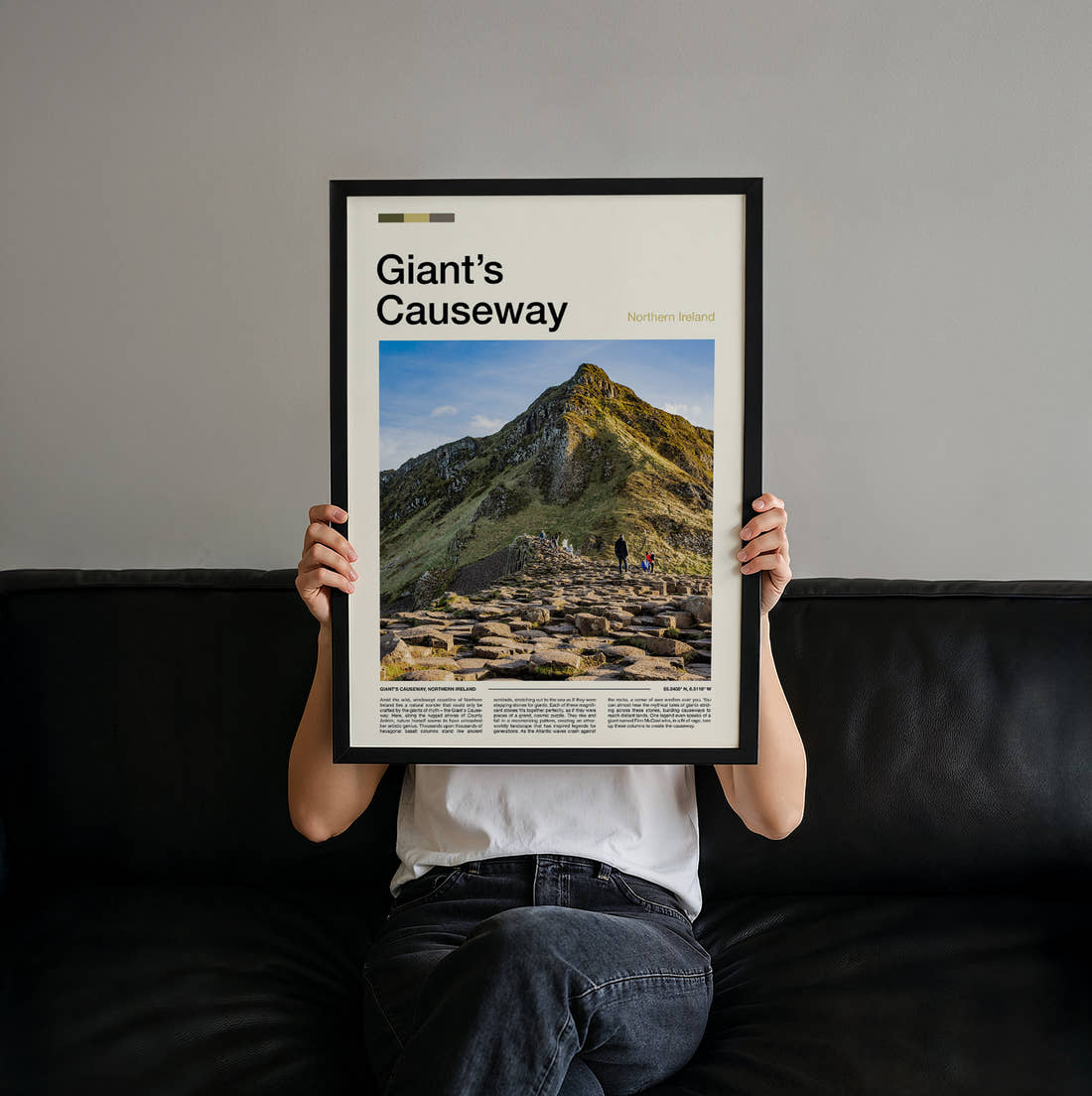 Giant's Causeway Rocky Cliff Path Travel Print held up by hand to show the size of the print