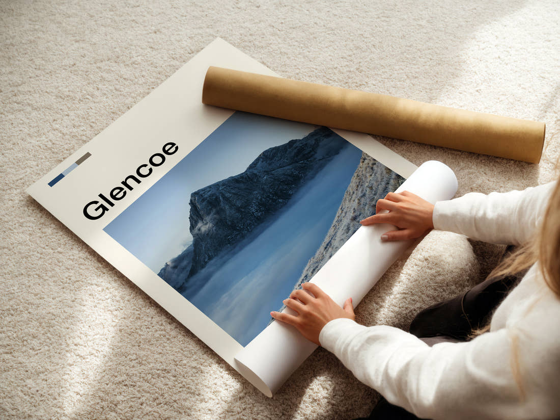 Glencoe Peak Above The Clouds Travel Print being unrolled from its postal tube