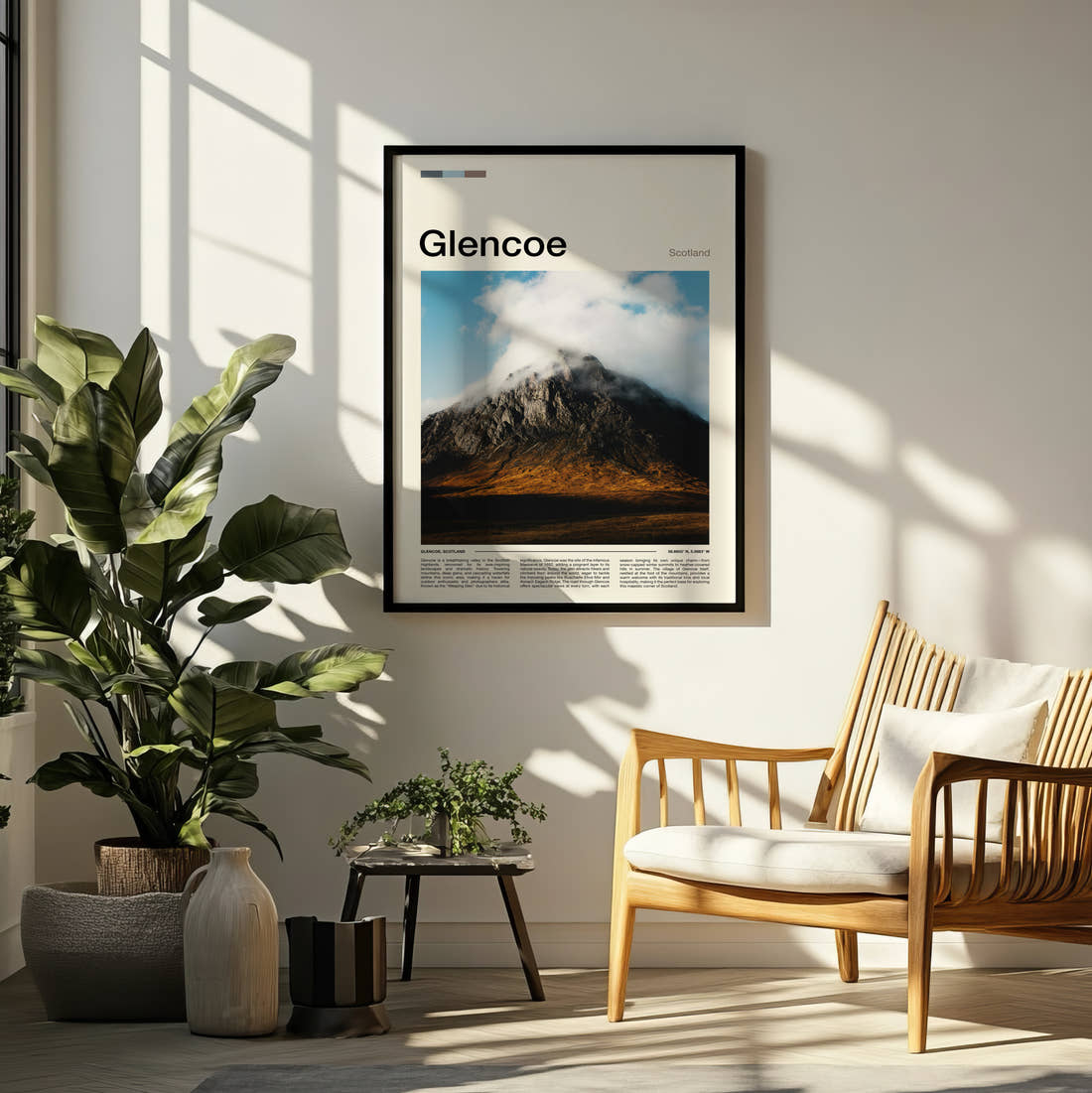 Glencoe Cloud Capped Mountain Travel Print framed on a pale wall beside houseplants