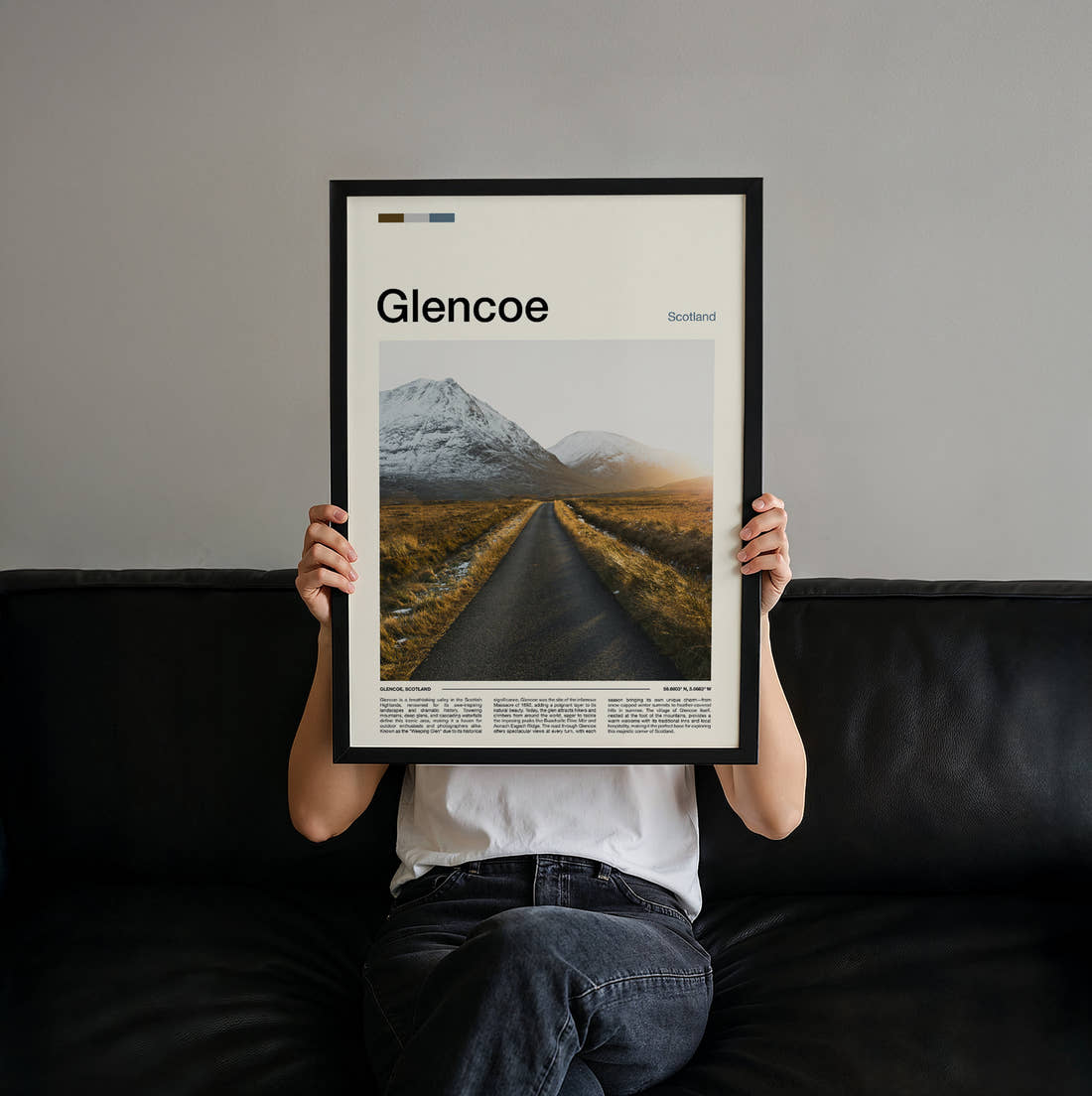 Glencoe Empty Road Through Mountains Travel Print held up by hand to show the size of the print