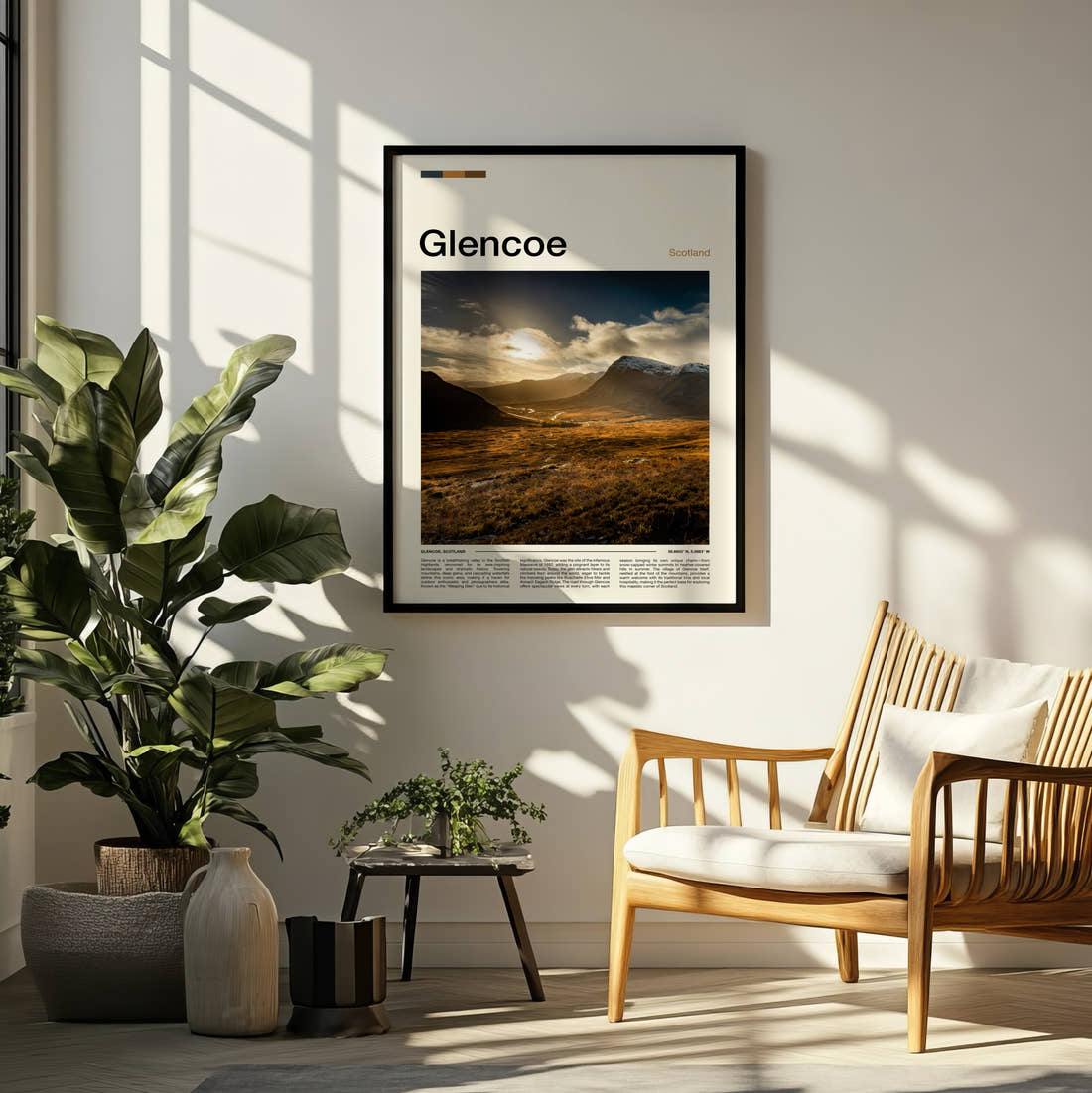Glencoe Sunlight Over The Valley Travel Print framed on a pale wall beside houseplants